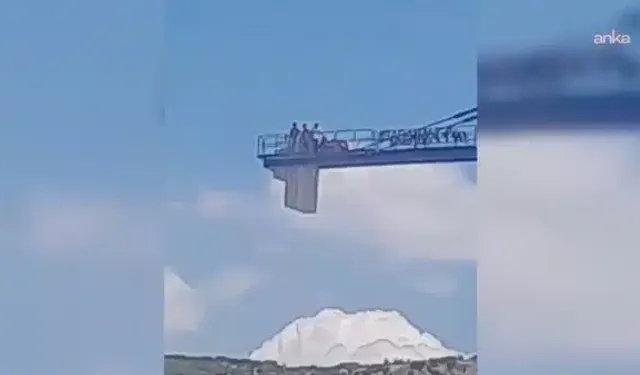 Ücretlerini alamadıklarını belirten işçiler kule vince çıktı